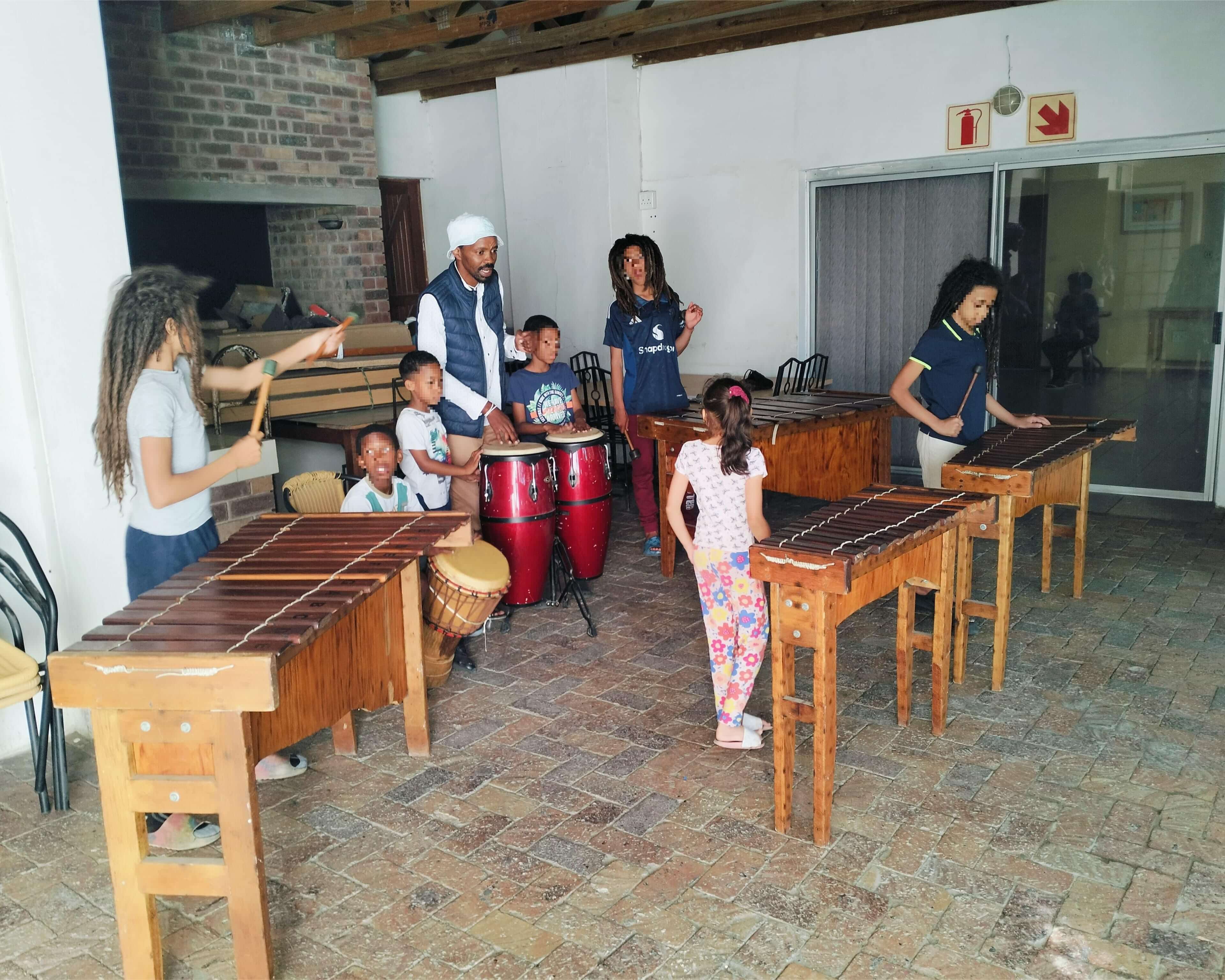 Girls and boys playing the marimba